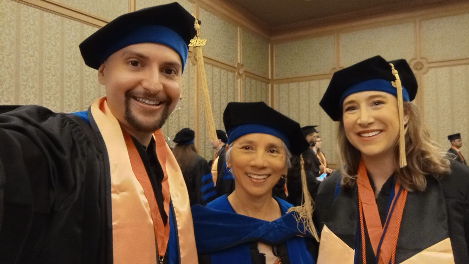 UTMB SPPH & GSBS Commencement Robert Rodriguez, Rebeca Wong, and Paige Downer attending commencement