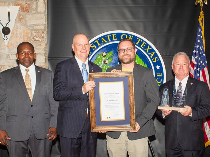 TDCJ Health Services Division Award Jeff Farroni 2 From left, Director of Chaplaincy and Volunteer Services Chris Carter, TDCJ Chairman Eric Nichols, Health Services Division Award recipient Dr. Jeff Farroni, and TDCJ Executive Director Bryan Collier