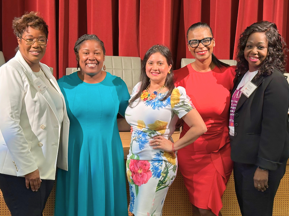 Dr. Hill with moderator and co-panelists
