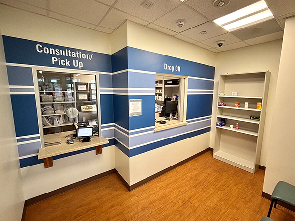 Where in the UTMB Two pharmacy windows that say "consultation/pick up" and "drop off"
